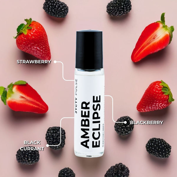 Roll-on bottle labeled 'Amber Eclipse' surrounded by strawberries and blackberries on a pink background
