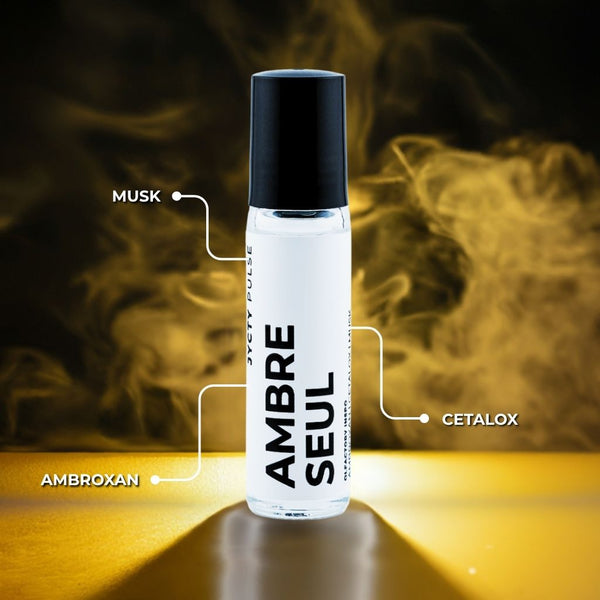 White bottle labeled 'Ambre Seul' with black cap on a dark background with smoke effects.