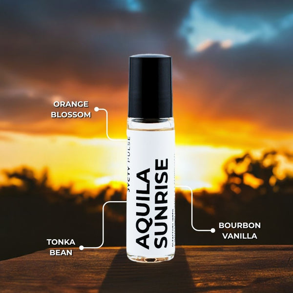 Aquila Sunrise perfume bottle with sunset background