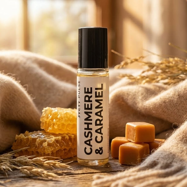 Roll-on bottle labeled 'Cashmere & Caramel' with honeycomb and caramel on a textured surface.