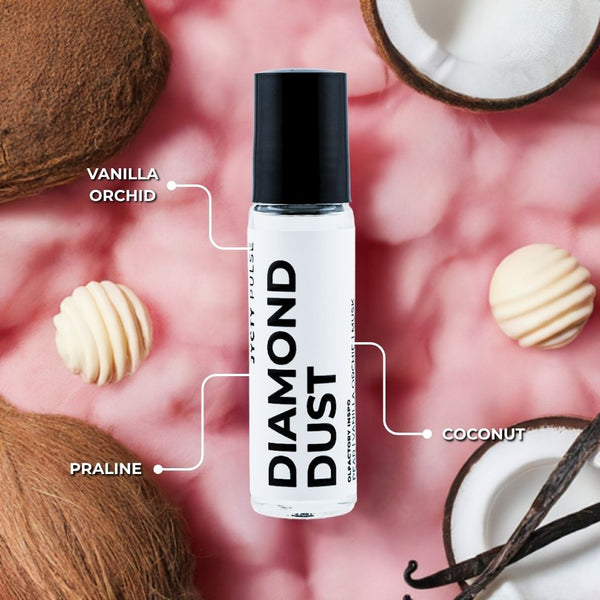 Diamond Dust roll-on product with vanilla orchid, praline, and coconut scents on a pink background.