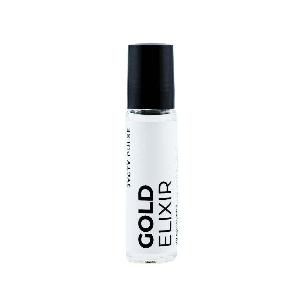 Bottle of 'Gold Elixir' with black cap on a white background