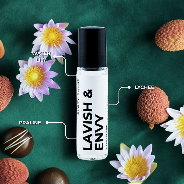 Lavish & Envy perfume bottle with flowers and chocolates on a green background