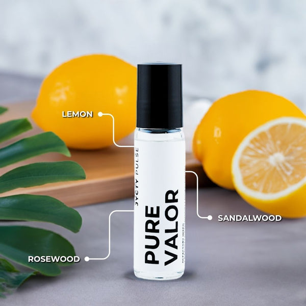 Roll-on bottle labeled 'PURE VALOR' with lemons and leaves on a wooden board.