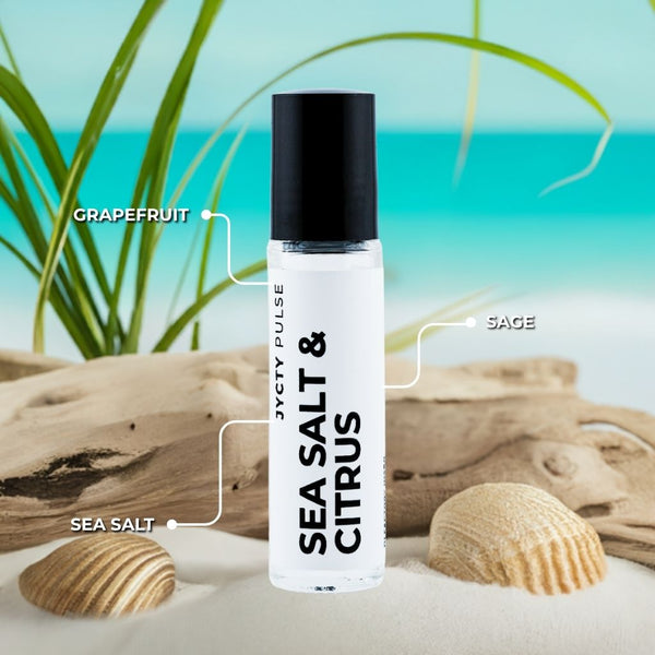 Roll-on bottle labeled 'Sea Salt & Citrus' with beach elements in the background