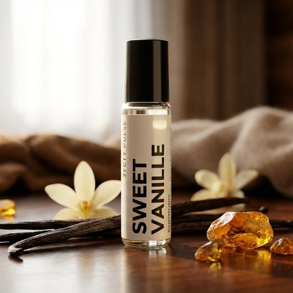 Roll-on bottle labeled 'Sweet Vanille' with vanilla beans and flowers on a wooden surface.